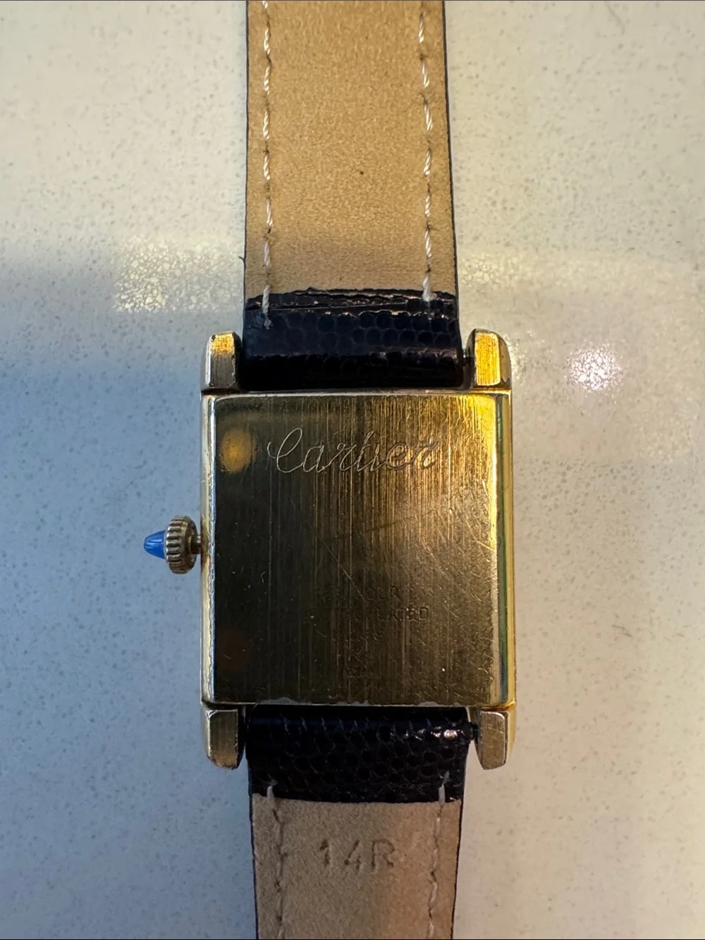 Cartier Gold Tone Rectangular Watch with dark brown Strap and sapphire Cabochon
